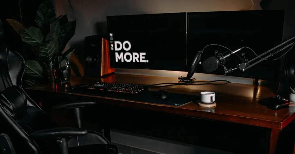 dark brown gaming desk ready for streaming in a black gaming room